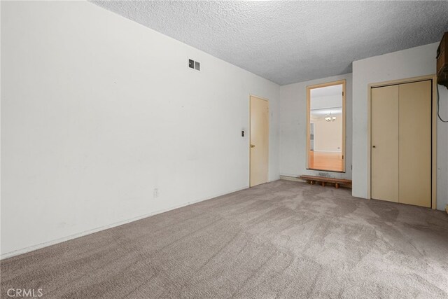 10120 Andasol Ave, Northridge, CA 91325 - unfurnished bedroom with carpet, a textured ceiling, and a closet