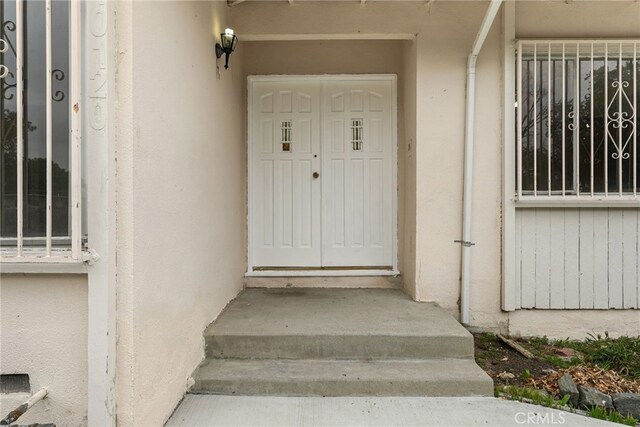 10120 Andasol Ave, Northridge, CA 91325 - entrance to property featuring stucco siding