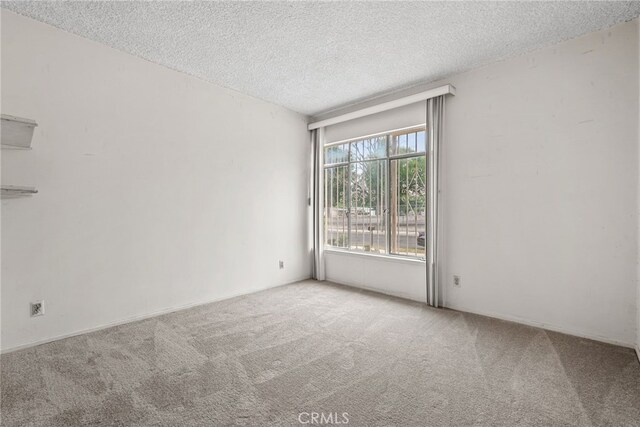 10120 Andasol Ave, Northridge, CA 91325 - carpeted spare room with a textured ceiling