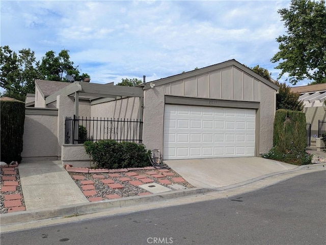 2811 Lancewood Ct, Fullerton, CA 92835 - view of front of home featuring concrete driveway, a garage, and stucco siding