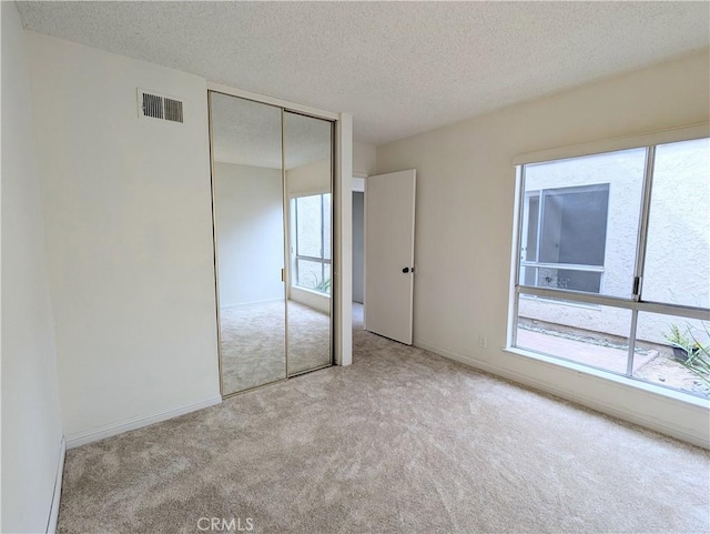 2811 Lancewood Ct, Fullerton, CA 92835 - unfurnished bedroom with carpet flooring, a textured ceiling, and a closet