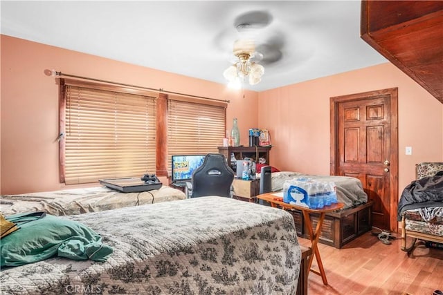4611 S Gramercy Pl, Los Angeles, CA 90062 - bedroom with light wood-style floors and ceiling fan