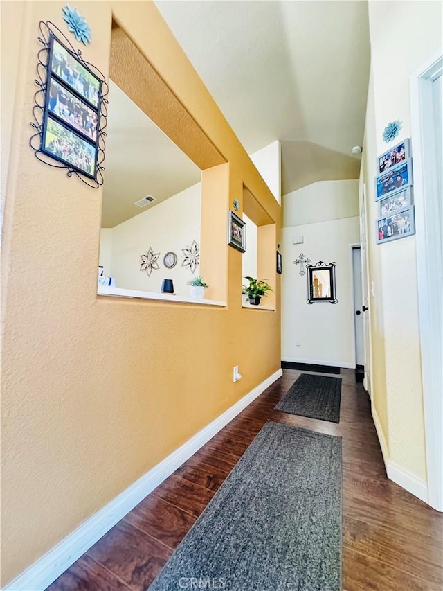 8925 Fallbrook Ct, Hesperia, CA 92344 - hall featuring dark wood finished floors and vaulted ceiling