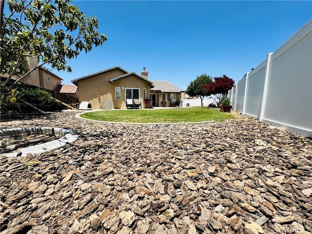 8925 Fallbrook Ct, Hesperia, CA 92344 - back of property with a chimney