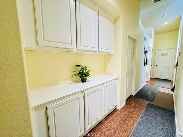 8925 Fallbrook Ct, Hesperia, CA 92344 - corridor featuring dark wood-style flooring and baseboards