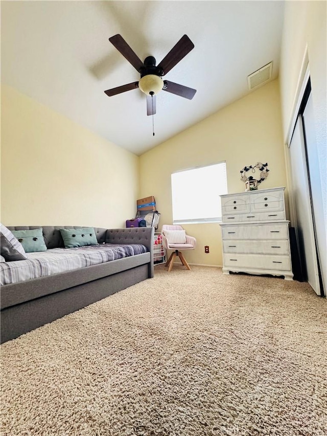 8925 Fallbrook Ct, Hesperia, CA 92344 - carpeted bedroom featuring vaulted ceiling, ceiling fan, and a closet