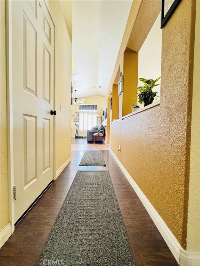 8925 Fallbrook Ct, Hesperia, CA 92344 - hallway with lofted ceiling, wood finished floors, and a textured wall