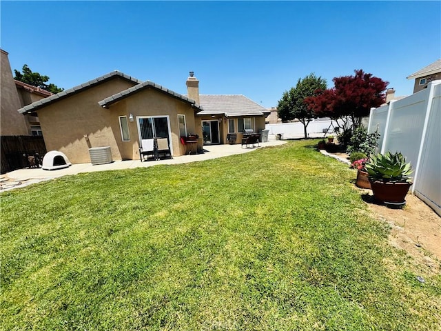 8925 Fallbrook Ct, Hesperia, CA 92344 - back of house featuring a patio area, a chimney, stucco siding, a tile roof, and cooling unit