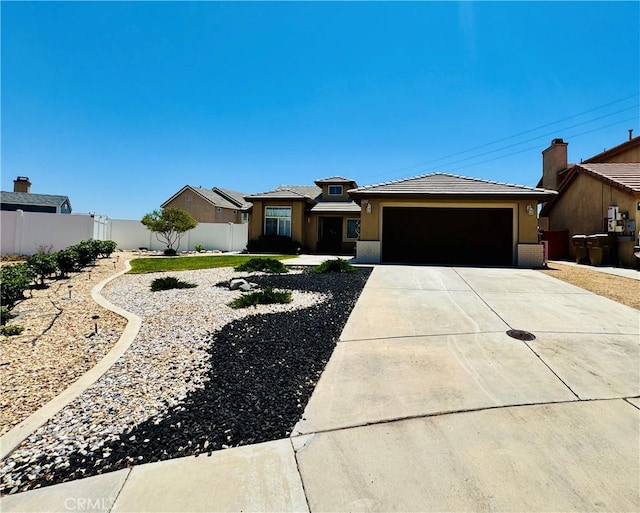8925 Fallbrook Ct, Hesperia, CA 92344 - view of front of house with a garage, concrete driveway, stucco siding, and a tiled roof