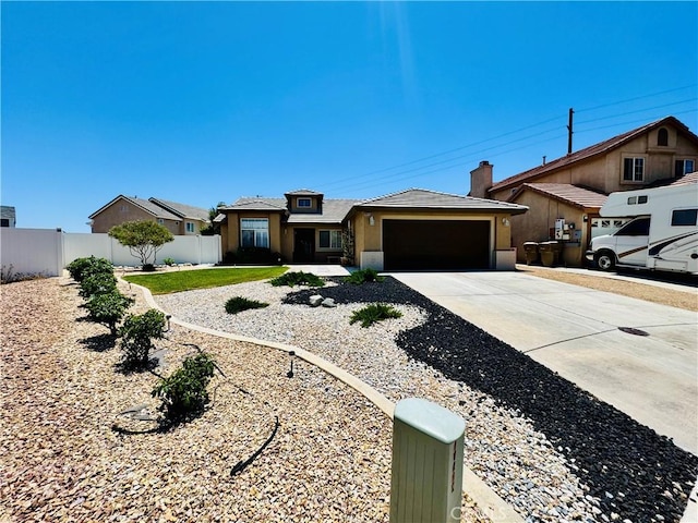 8925 Fallbrook Ct, Hesperia, CA 92344 - view of front of property featuring a garage, driveway, and stucco siding