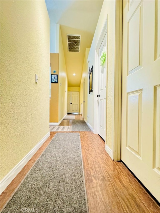 8925 Fallbrook Ct, Hesperia, CA 92344 - hallway featuring a textured wall, baseboards, and light wood-type flooring