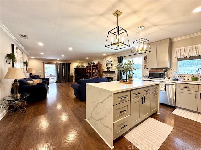 18839 Watson Ave, Cerritos, CA 90703 - kitchen with stainless steel appliances, open floor plan, ornamental molding, dark wood-style floors, and a kitchen island