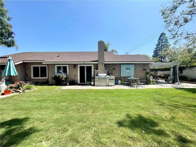 18839 Watson Ave, Cerritos, CA 90703 - back of house featuring an outdoor kitchen, a patio area, stucco siding, a lawn, and a chimney