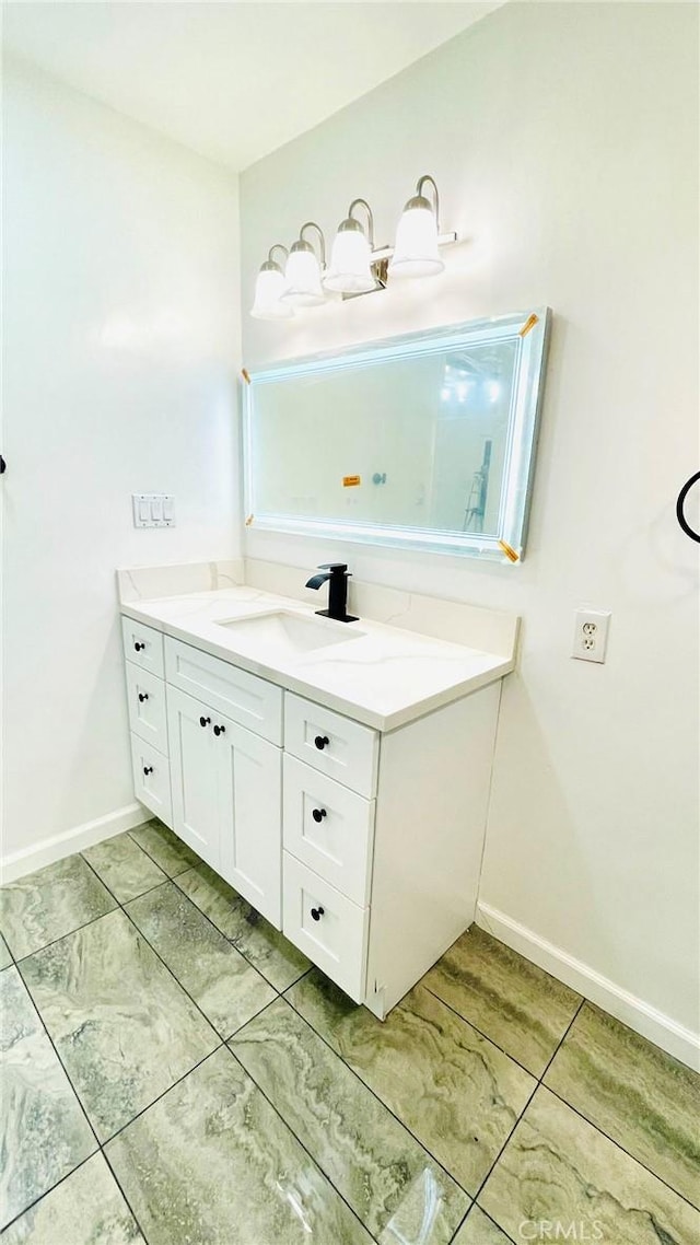 14940 Beckner St, La Puente, CA 91744 - bathroom with vanity and baseboards
