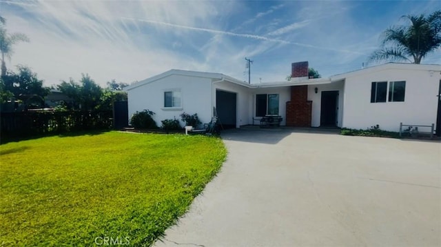 14940 Beckner St, La Puente, CA 91744 - ranch-style home featuring stucco siding, concrete driveway, a front yard, and a chimney