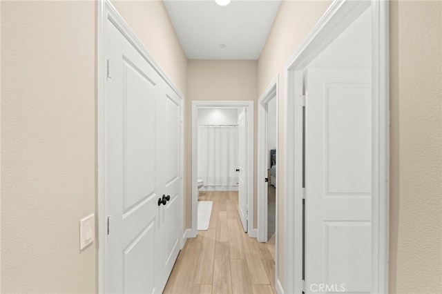 34452 Turquoise Ln, Murrieta, CA 92563 - corridor with light wood-type flooring and baseboards