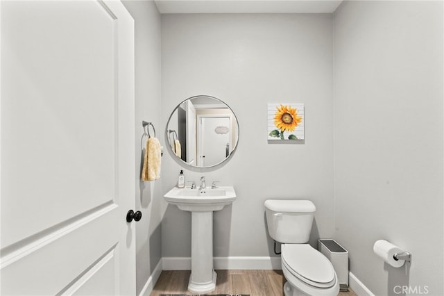 34452 Turquoise Ln, Murrieta, CA 92563 - bathroom featuring toilet, baseboards, wood finished floors, and a sink