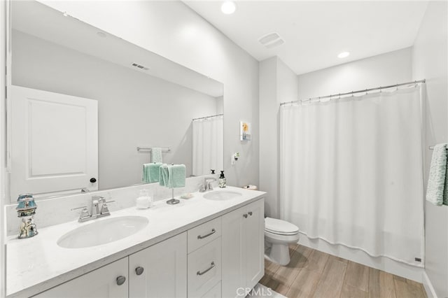 34452 Turquoise Ln, Murrieta, CA 92563 - full bath with double vanity, wood finished floors, toilet, and shower / bath combo