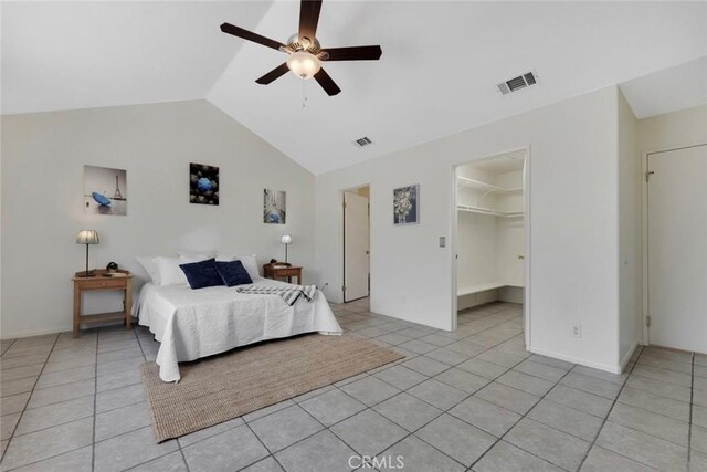 13421 Hubbard St Unit 125, Sylmar, CA 91342 - bedroom featuring vaulted ceiling, light tile patterned flooring, ceiling fan, a spacious closet, and a closet