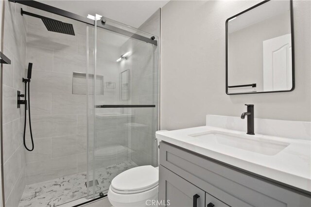 9406 Glenaire Ct, Rancho Cucamonga, CA 91730 - full bathroom with vanity, toilet, and a shower stall