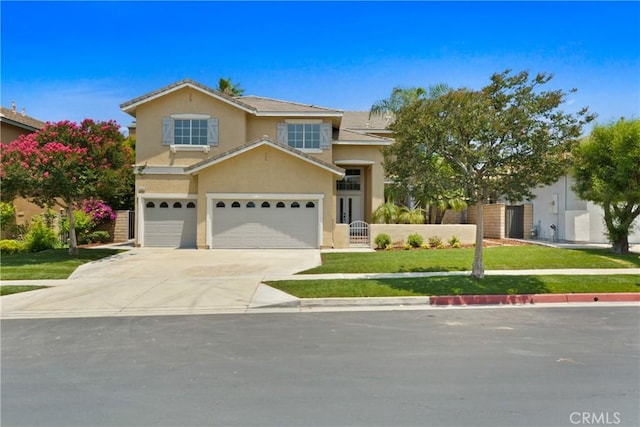9406 Glenaire Ct, Rancho Cucamonga, CA 91730 - view of front facade featuring stucco siding, driveway, and a garage