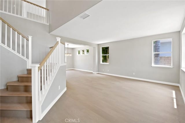 9406 Glenaire Ct, Rancho Cucamonga, CA 91730 - stairs with wood finished floors and baseboards