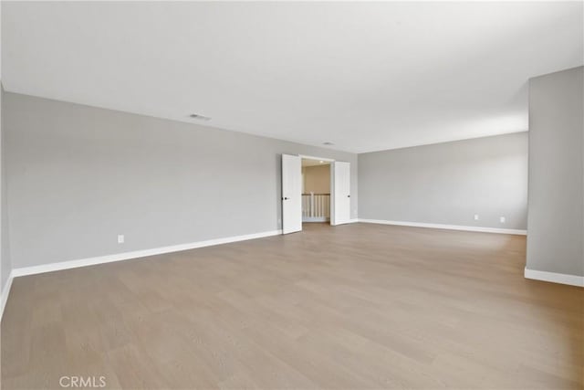 9406 Glenaire Ct, Rancho Cucamonga, CA 91730 - spare room featuring light wood-style flooring and baseboards
