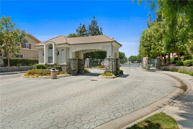 9406 Glenaire Ct, Rancho Cucamonga, CA 91730 - view of street with a gate, curbs, and a gated entry