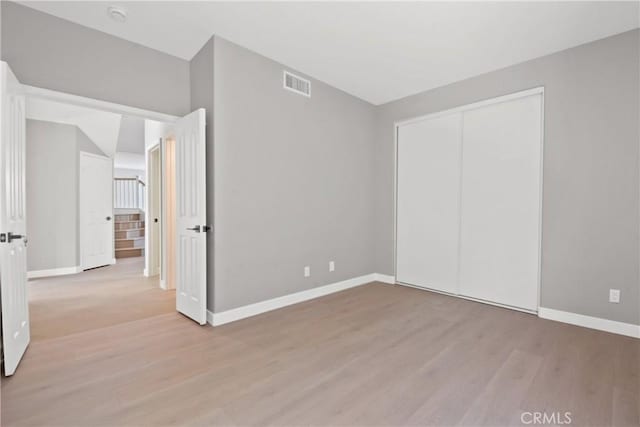 9406 Glenaire Ct, Rancho Cucamonga, CA 91730 - unfurnished bedroom with baseboards, wood finished floors, and a closet