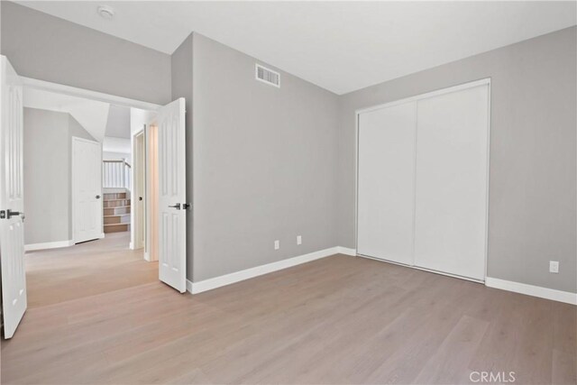 9406 Glenaire Ct, Rancho Cucamonga, CA 91730 - unfurnished bedroom with baseboards, wood finished floors, and a closet