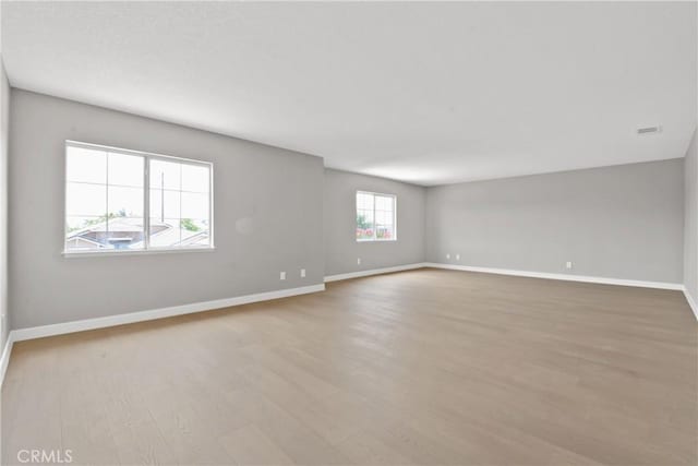 9406 Glenaire Ct, Rancho Cucamonga, CA 91730 - spare room featuring wood finished floors and baseboards