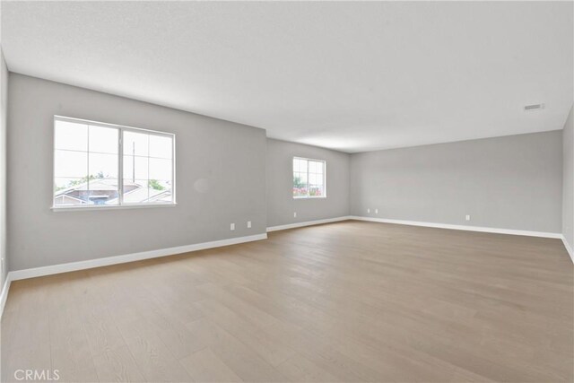9406 Glenaire Ct, Rancho Cucamonga, CA 91730 - spare room with wood finished floors and baseboards