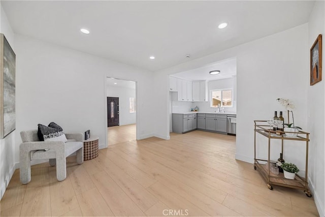2035 Las Colinas Ave, Los Angeles, CA 90041 - living area featuring light wood finished floors, recessed lighting, and baseboards