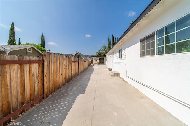2035 Las Colinas Ave, Los Angeles, CA 90041 - view of side of home featuring stucco siding and a patio