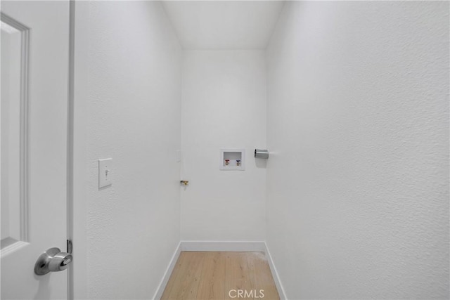 2035 Las Colinas Ave, Los Angeles, CA 90041 - washroom featuring light wood-style flooring, baseboards, and washer hookup