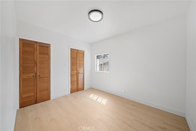 2035 Las Colinas Ave, Los Angeles, CA 90041 - unfurnished bedroom featuring wood finished floors and baseboards