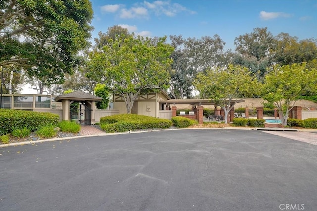 543 Rockport Ct, Encinitas, CA 92024 - view of property with uncovered parking and an outdoor pool