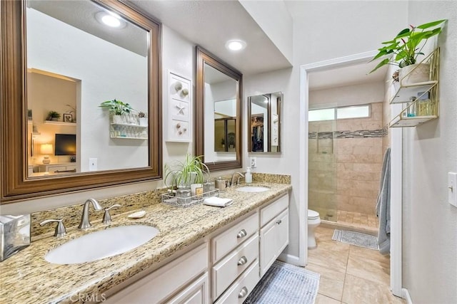 543 Rockport Ct, Encinitas, CA 92024 - bathroom with toilet, a stall shower, double vanity, and tile patterned floors