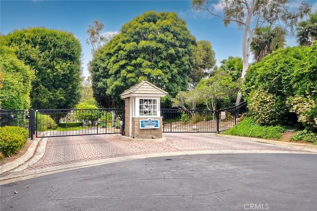 543 Rockport Ct, Encinitas, CA 92024 - view of street with a gate, curbs, and a gated entry