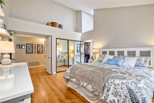 543 Rockport Ct, Encinitas, CA 92024 - bedroom with light wood-style flooring, high vaulted ceiling, a closet, and baseboards