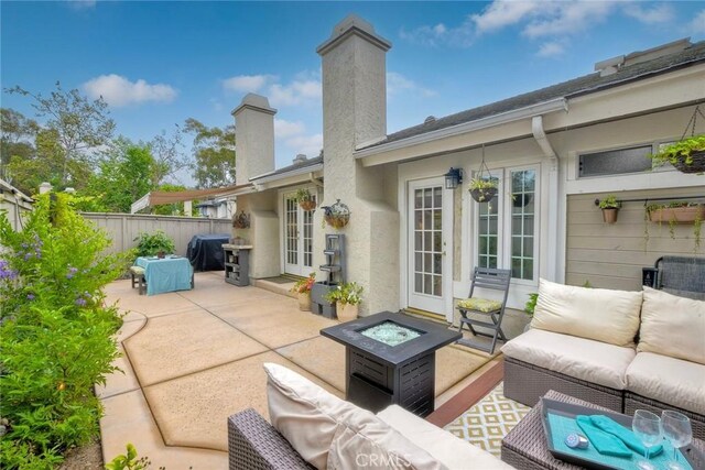 543 Rockport Ct, Encinitas, CA 92024 - view of patio / terrace with french doors, an outdoor living space with a fire pit, and area for grilling