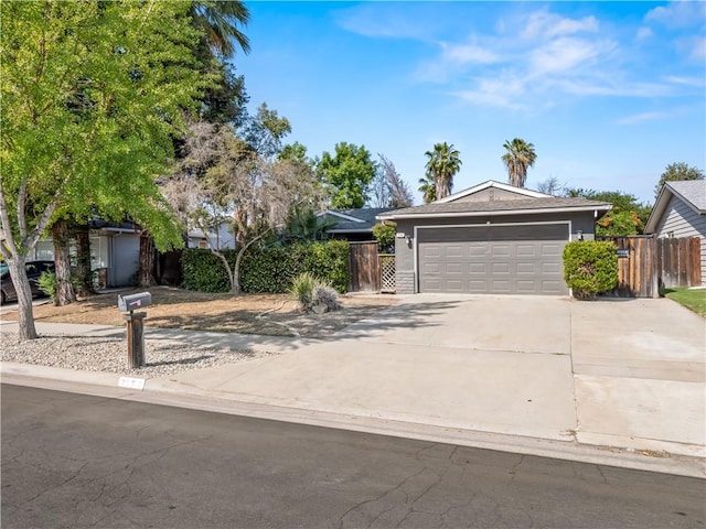 7352 N Adoline Ave, Fresno, CA 93711 - ranch-style house with concrete driveway and an attached garage