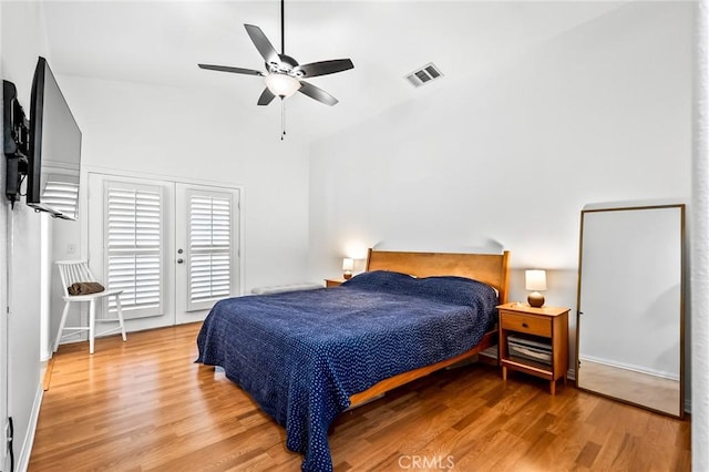 57146 Selecta Ave, Yucca Valley, CA 92284 - bedroom with wood finished floors, access to outside, a ceiling fan, and high vaulted ceiling