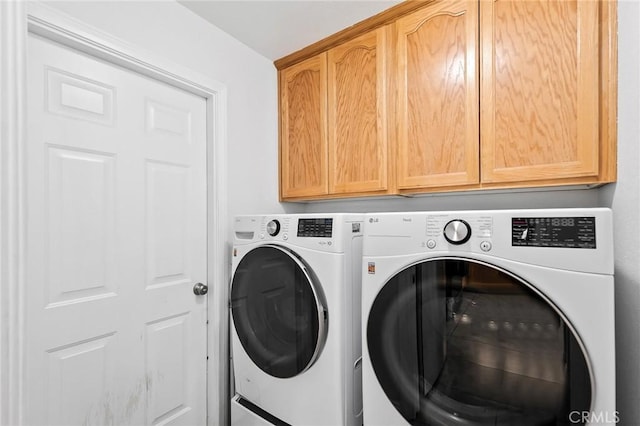 57146 Selecta Ave, Yucca Valley, CA 92284 - laundry room with cabinet space and washer and dryer