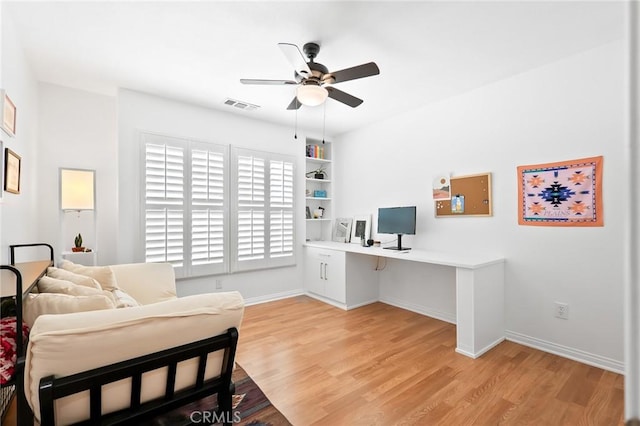 57146 Selecta Ave, Yucca Valley, CA 92284 - bedroom with a desk, light wood-style flooring, baseboards, and ceiling fan