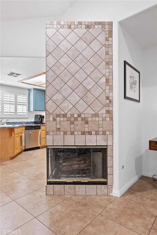 57146 Selecta Ave, Yucca Valley, CA 92284 - detailed view of stainless steel dishwasher, a fireplace, baseboards, and a sink