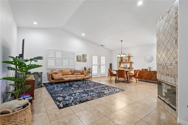 57146 Selecta Ave, Yucca Valley, CA 92284 - living room featuring recessed lighting, light tile patterned floors, high vaulted ceiling, and a chandelier