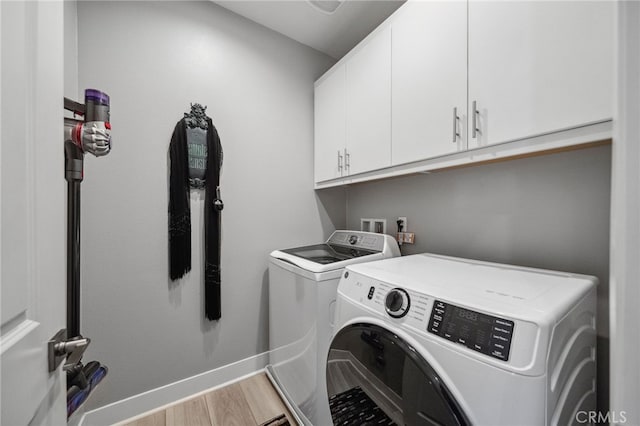 45445 Calle Cirros, Temecula, CA 92592 - washroom featuring cabinet space, separate washer and dryer, and light wood-style floors