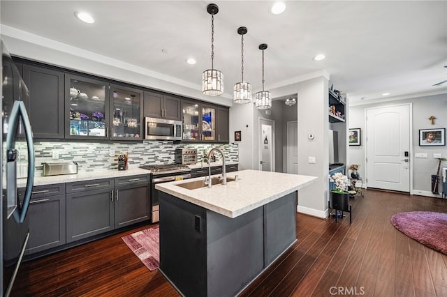 45445 Calle Cirros, Temecula, CA 92592 - kitchen with stainless steel appliances, ornamental molding, backsplash, recessed lighting, and hanging light fixtures
