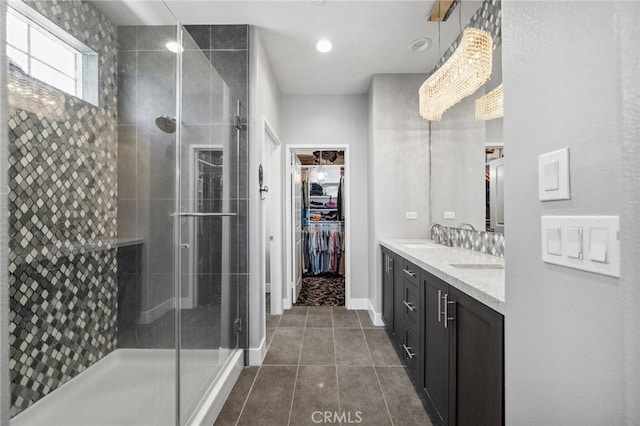 45445 Calle Cirros, Temecula, CA 92592 - full bath featuring double vanity, a stall shower, tile patterned flooring, a spacious closet, and recessed lighting
